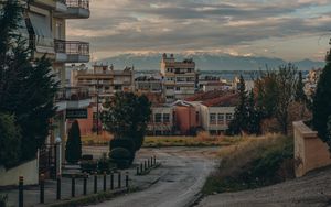 Preview wallpaper buildings, houses, road, mountains, city