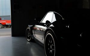 Preview wallpaper car, black, garage, darkness