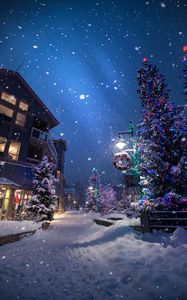 Preview wallpaper christmas, new year, winter, street, snowfall, mood