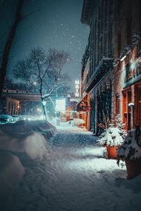 Preview wallpaper city, evening, snowfall, winter, street, buildings