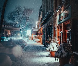 Preview wallpaper city, evening, snowfall, winter, street, buildings