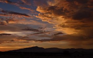 Preview wallpaper hills, silhouettes, clouds, sky, evening, nature