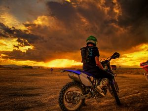 Preview wallpaper motorcyclist, motorcycle, sunset