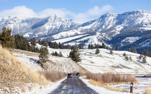 Preview wallpaper road, cars, snow, hills, mountains