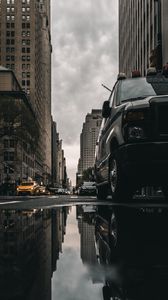 Preview wallpaper street, puddle, reflection, cars, buildings, asphalt