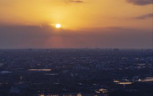 Preview wallpaper sunrise, buildings, city, sky, clouds