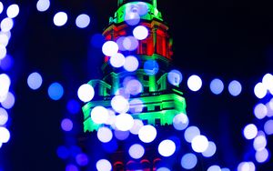 Preview wallpaper tower, building, lights, illumination, blur, new year, holiday